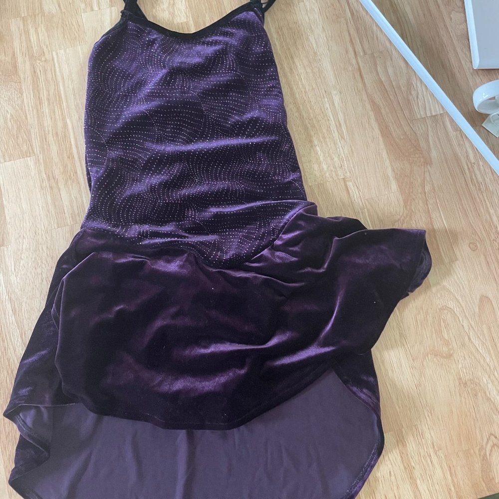 Purple figure skating with subtle detailing and glitter